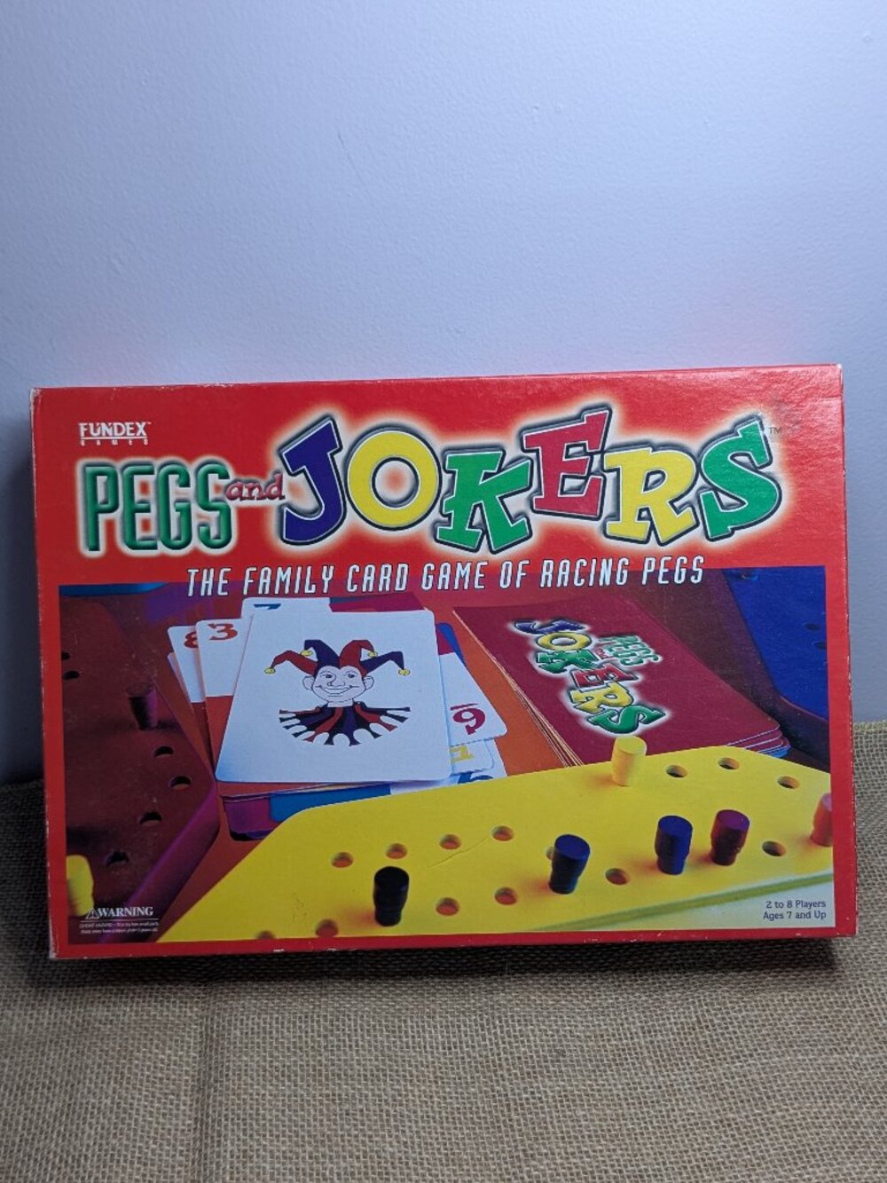 New Pegs and Jokers Game Vintage 1999 Fundex Racing Family Strategy Board Game